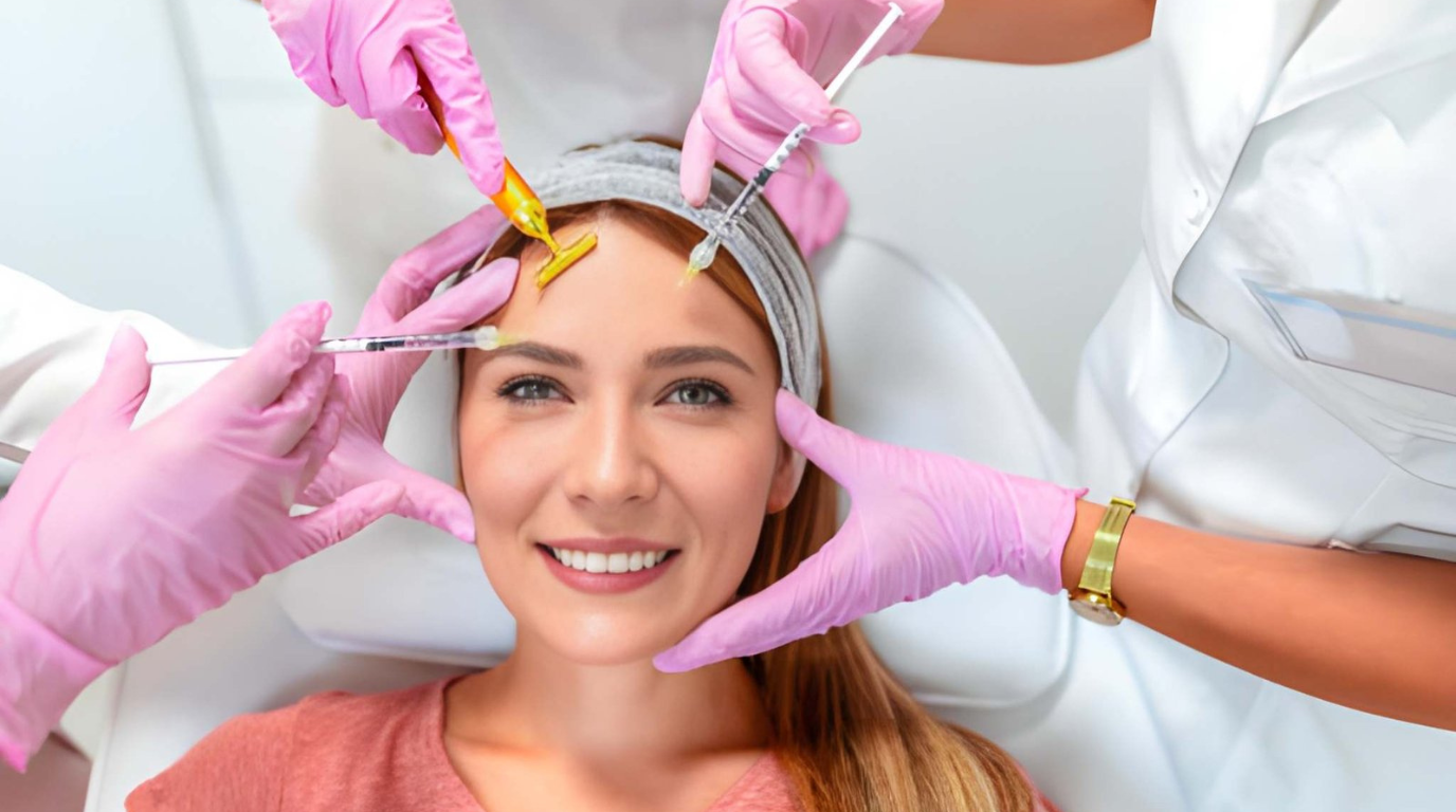 A woman receives an eyebrow shaping treatment at a beauty salon, focused on her reflection in the mirror.