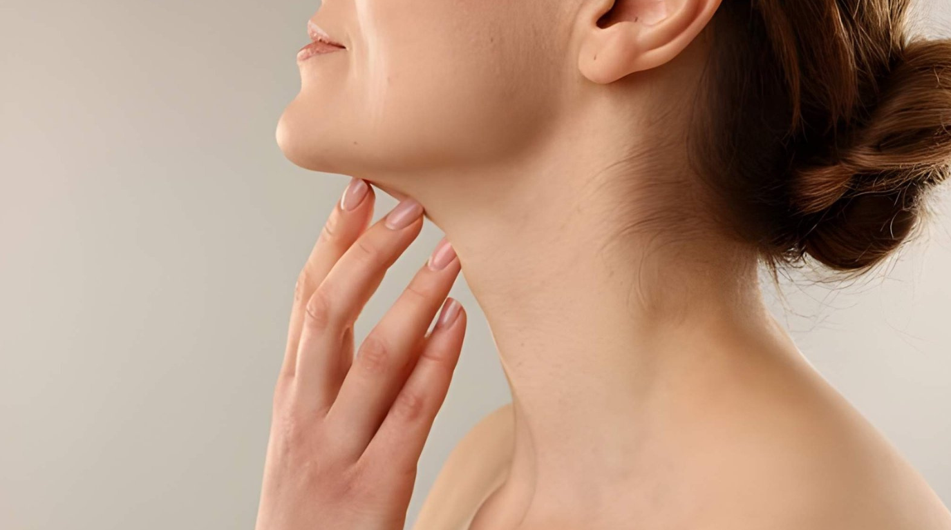 A woman supporting her chin with her hands, displaying a thoughtful expression.